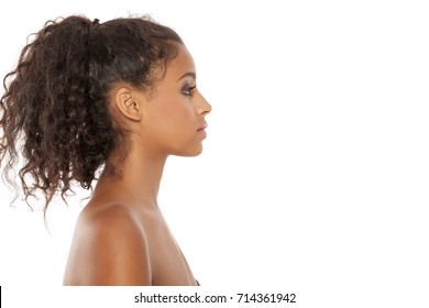 Profile of a beautiful young dark-skinned woman on a white background