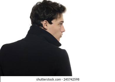 Profile Of A Beautiful Young Man Dressed In A Black Long Coat, Posing Fashion