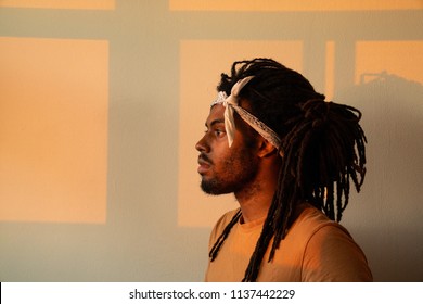 Profile Of Black Man With White Bandana During Golden Hour