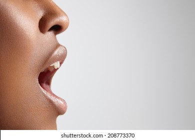 profile of a black woman with open mouth - Shutterstock ID 208773370