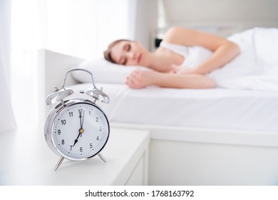 Profile Blurry Focus Photo Of Charming Lady Lying Sleeping Bed White Sheets Blanket Calm Sure Metal Alarm Clock Will Ring At Seven O'clock Morning Work House Monday Bedroom Indoors