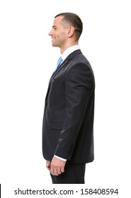 Profile Of Business Man Wearing Black Suit And Blue Tie, Isolated On White