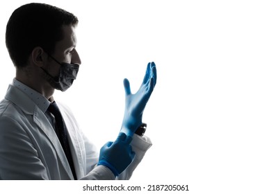 Profile Of Caucasian Doctor Wearing Latex Gloves, Mask And White Coat Isolated On White Background. Silhouette Portrait With Face Mask Medical Worker In White Coat