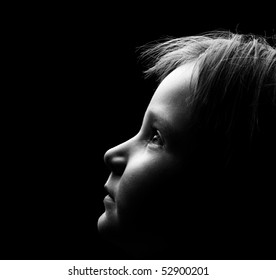 Profile Of A Child's Face With High Contrast Light