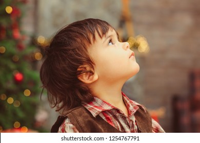 Profile Close Up Warm Portrait Of The Face Of Small Boy With Dark Messy Hair, Long Eyelashes, Sweet Beautiful Face, Dark Big Eyes, Looking Up, Checked Collar Shirt, Blurred Background