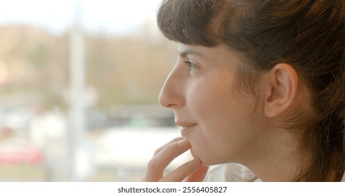 Profile of a contemporary urban woman who is deeply engaged in thoughtful contemplation and reflection. Close-up emotion of thoughtfulness, calm and introspective expression, quiet focus. - Powered by Shutterstock