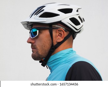 Profile Of A Cyclist, Wearing A Helmet And Sunglasses.