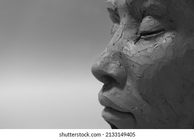 Profile face sculpture. Black and white style. Female clay portrait with closed eyes. - Powered by Shutterstock