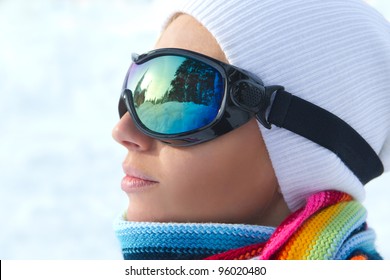 Profile Of Female Skier Wearing Ski Glasses In The Mountains