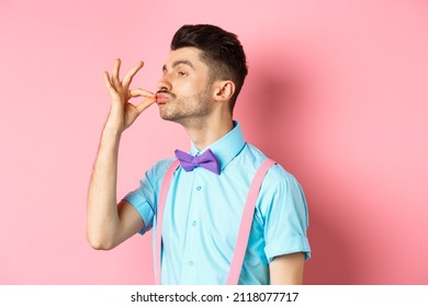 Profile Of Funny Guy Touching His French Moustache And Pucker Lips Like Snob, Standing Smug On Pink Background And Look Left