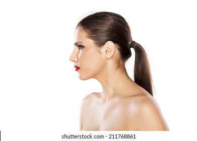 Profile Of A Girl With A Pony Tail On White Background