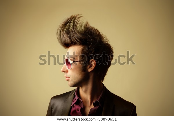 profile of guy with big\
tuft