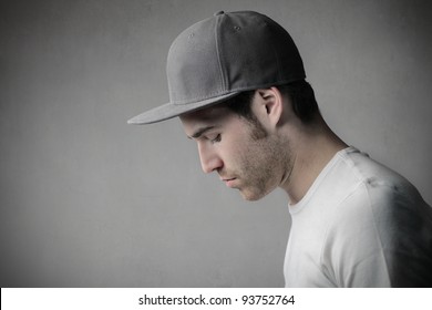 Profile of a handsome man wearing a cap
