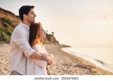 Profile happy romantic satisfied smiling young couple two friends family man woman 20s in white clothes hug rest together at sunrise over sea beach ocean outdoor seaside in summer day sunset evening. - Shutterstock ID 2053474361