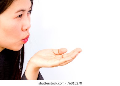 Profile Image Of A Lovely Young Woman Blowing A Kiss On White Background