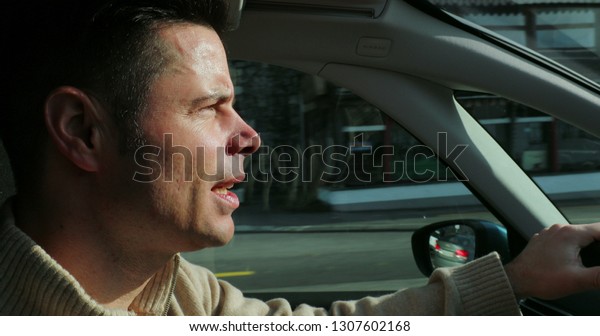 Profile of man\
driving