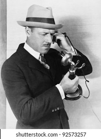 Profile Of A Man Talking On The Telephone