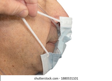 Profile Of A Old Man With Nasal Cannula In Nose. Hand Puts On A Medical Mask On His Face.