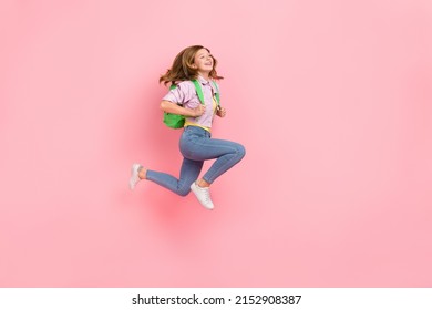 Profile photo of active carefree lady jump rush back to school wear bag jacket isolated pink color background - Shutterstock ID 2152908387