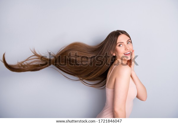 Profile
photo of attractive cute model lady demonstrating ideal neat long
healthy hairstyle flying on air after lamination procedure wear
beige singlet isolated grey color
background