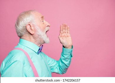 Profile Photo Of Attractive Grandpa Looking Empty Space Hand Near Open Mouth Yelling Secret Information People Crowd Wear Mint Shirt Suspenders Bow Tie Isolated Pink Pastel Color Background