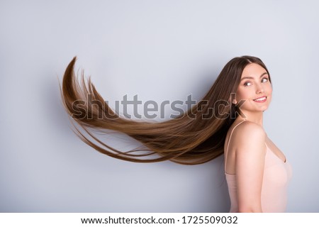 Similar – Image, Stock Photo young woman with long brown hair in red dress from behind, looking down, in the garden backlit with sunshine. summer outdoor lifestyle portrait.