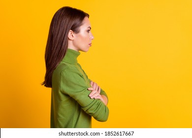 Profile Photo Of Bossy Lady Hold Arms Crossed Look Side Empty Space Wear Casual Sweater Isolated Yellow Color Background