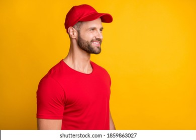 Profile Photo Of Cheerful Positive Man Look Empty Space Wear Red T-shirt Hat Isolated Yellow Color Background