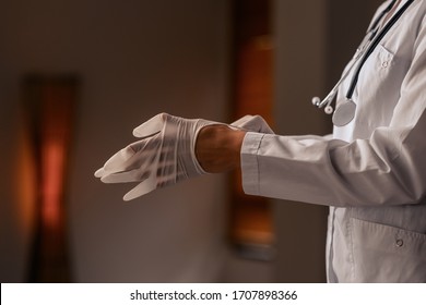 Profile Photo, Close-up: The Doctor Puts On Sterile Disposable Latex Gloves. Asepsis. Security. Medicine