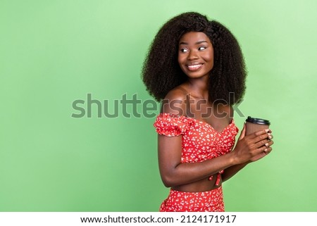 Profile photo of cute young wavy hairdo brunette lady drink coffee look empty space wear red printed top isolated on green color background