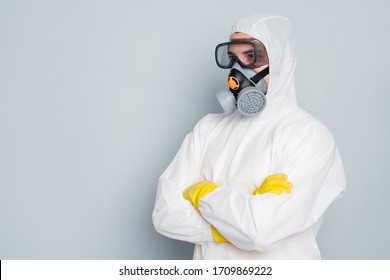 Profile photo of epidemic specialist guy disinfectant control public places disinfecting cleaning arms crossed wear hazmat protective suit goggles mask isolated grey color background