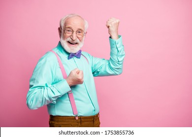 Profile Photo Of Funky Crazy Grandpa Raise Fists Ecstatic Good Mood Cool Achievement Wear Specs Mint Shirt Suspenders Violet Bow Tie Trousers Isolated Pink Pastel Color Background