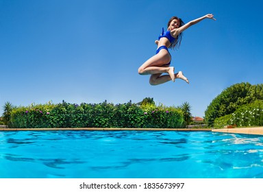 Profile Photo Of The Girl Jump High In Action Happy Pose With Lifted Hands Dive In The Outdoor Swimming Pool