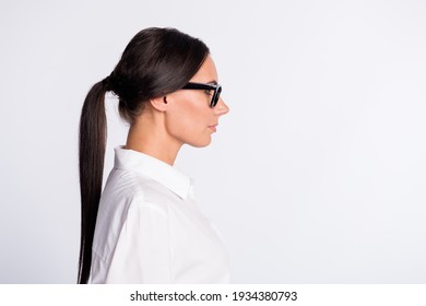 Profile photo of optimistic brunette hairdo lady near empty space wear spectacles white shirt isolated on grey color background