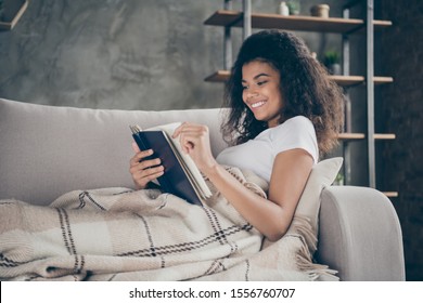 Profile Photo Of Pretty Amazing Dark Skin Wavy Lady Hold Book Reading Favorite Love Story Historic Novel Lying Comfy Couch Covered With Plaid Blanket Living Room Indoors