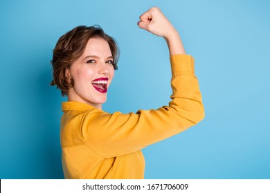 Profile Photo Of Pretty Cheerful Lady Hold Raise Biceps Hand Arm Show Perfect Biceps Gym Training Strong Powerful Woman Wear Yellow Shirt Isolated Bright Blue Color Background