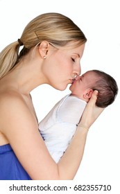 A Profile Photo Of A Pretty, Young Mother Gently Kissing Her Swaddled New Born Baby On The Lips (isolated On A White). 