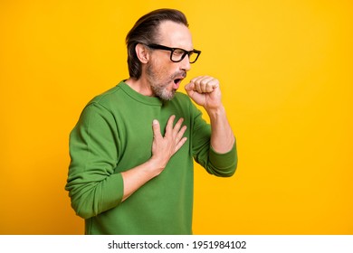 Profile Photo Of Sick Guy Coughing Open Mouth Hand Chest Wear Spectacles Green Pullover Isolated Yellow Color Background