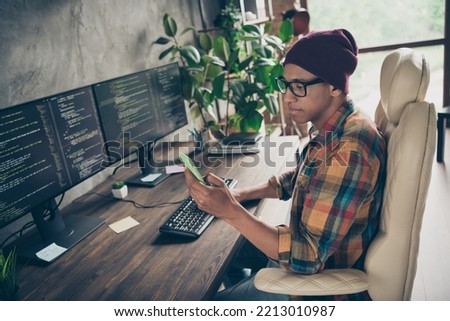 Profile photo of smart professional web designer sit chair use telephone instagram twitter facebook telegram workstation office indoors