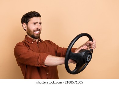 Profile Photo Of Unsatisfied Worried Person Hold Wheel Arm Beep Horn Look Empty Space Isolated On Beige Color Background