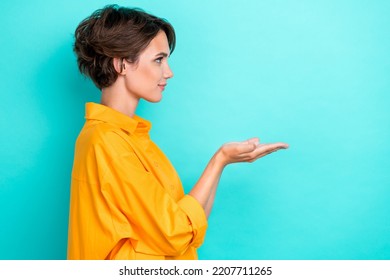 Profile photo of young adorable pretty nice cute woma wear bright shirt hold palms new product recommend advertising isolated on aquamarine color background