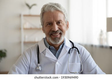 Profile Picture Of Smiling Mature Caucasian Male Doctor In White Medical Uniform In Private Hospital. Portrait Of Happy Senior Man GP Talk On Video Call, Speak In Webcam Conference With Patient.