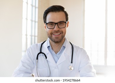 Profile Picture Of Smiling Young Caucasian Male Doctor In White Medical Uniform Show Good Quality Service In Hospital. Headshot Portrait Of Happy Man GP Or Pediatrician In Clinic. Healthcare Concept.