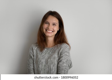 Profile picture of smiling young red-haired woman stand isolated on grey studio background show positive optimistic spirit, portrait of happy Caucasian female pose demonstrate white healthy teeth - Shutterstock ID 1800996052