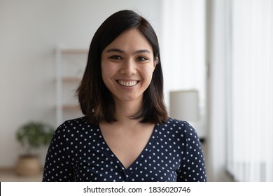 Profile Picture Of Smiling Young Vietnamese Woman Show Optimism Leadership. Close Up Headshot Portrait Of Happy Millennial Asian 20s Female Renter Or Tenant Pose Look At Camera In Own Flat Apartment.