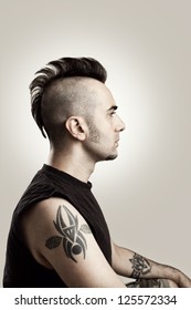 Profile Picture Of A Tattooed Man With Mohawk Style Hair