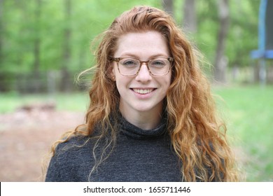 Profile picture of a young adult outside.