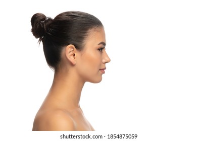 Profile. Portrait of beautiful young woman on white studio background. Concept of cosmetics, makeup, natural and eco treatment, skin care. Shiny and healthy look, fashion, healthcare. Copyspace.