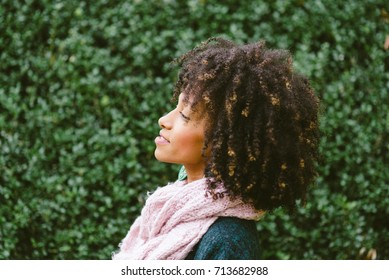 Profile Portrait Of Black Woman With Afro Style Hair In Autumn.