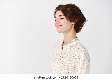 Profile Portrait Of Candid Beautiful Woman Close Eyes And Smile, Turn Face Aside To The Left Empty Space, Imaging Or Dreaming, Standing Romantic On White Background.